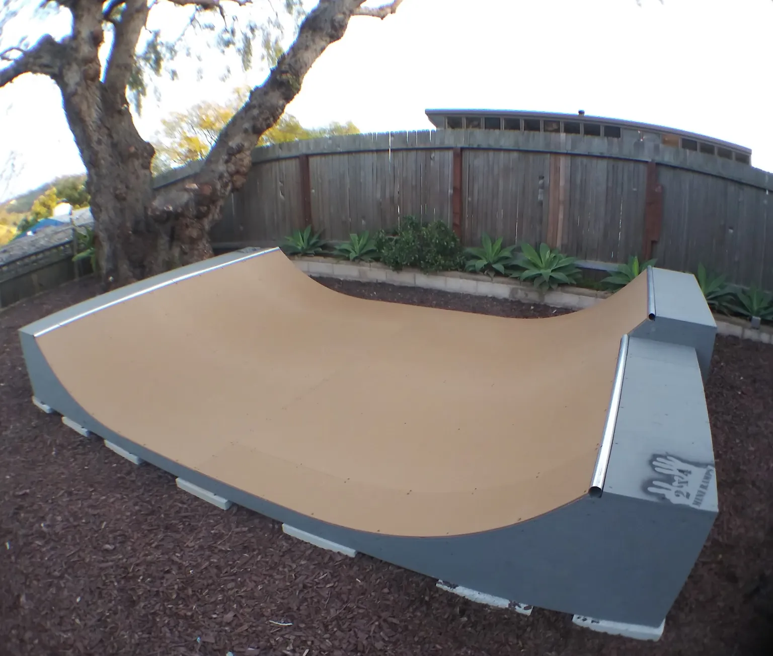 Two foot high miniramp with six inch extension on foundation footer blocks in dirt yard