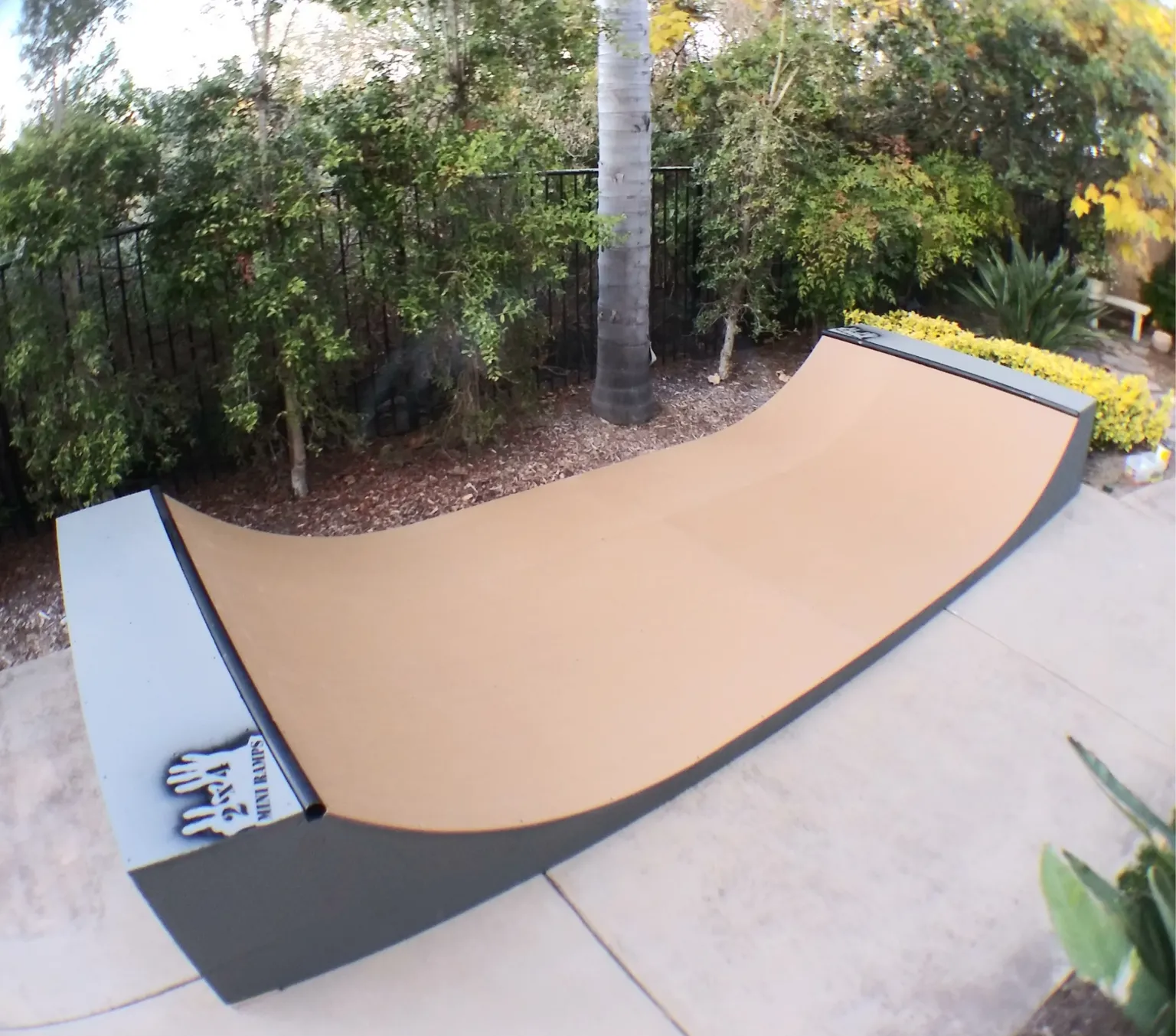 Two foot high miniramp on patio by BBQ grill