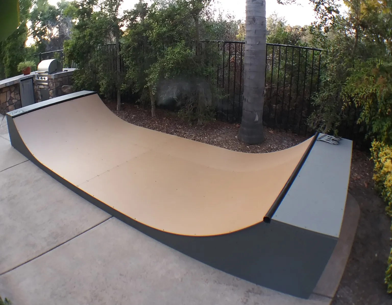 Two foot high miniramp on patio by BBQ grill