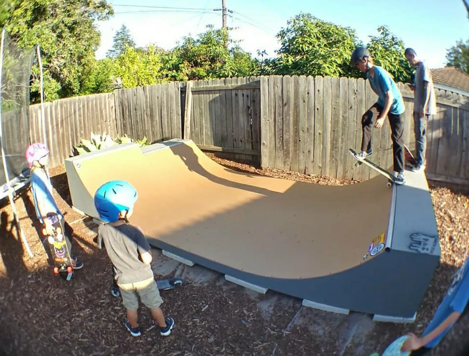 Two foot high miniramp with six inch extension with kid dropping in