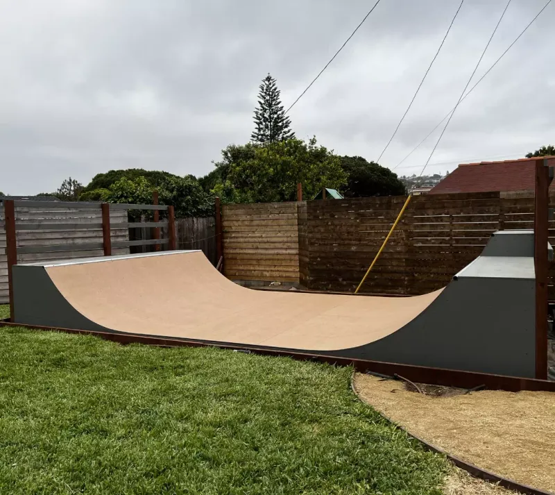 Three foot high miniramp in grass backyard