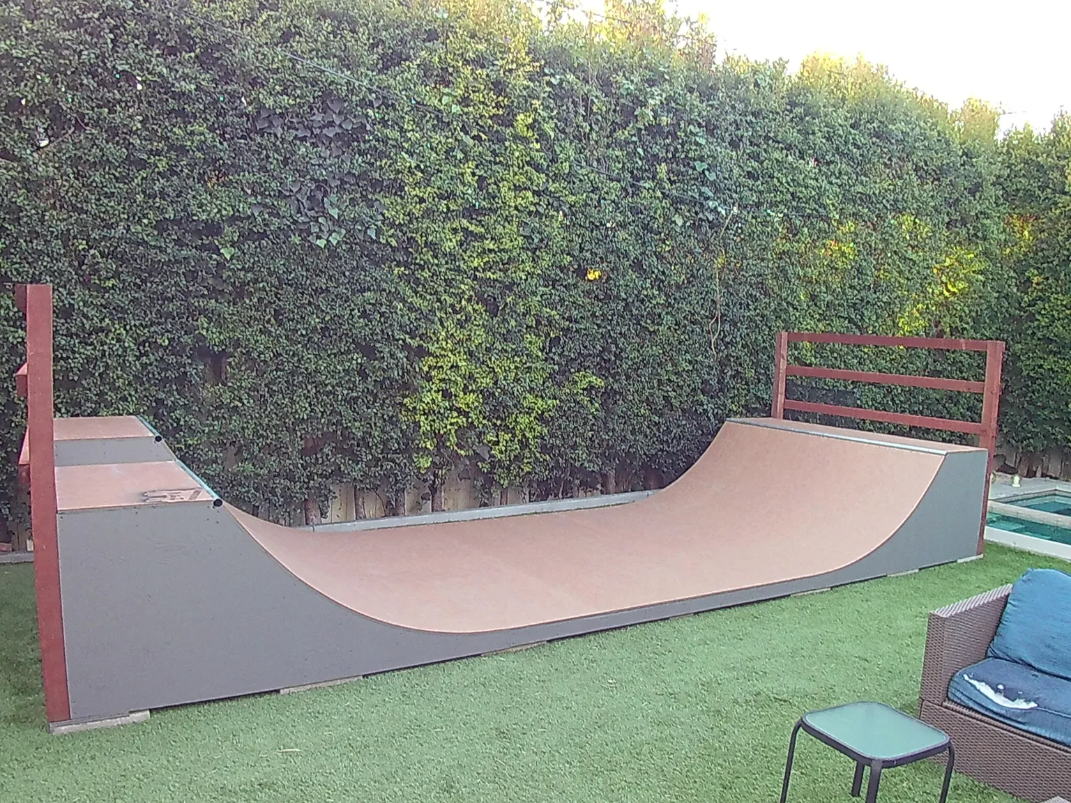 Three foot high miniramp on foundation footer blocks in grass backyard