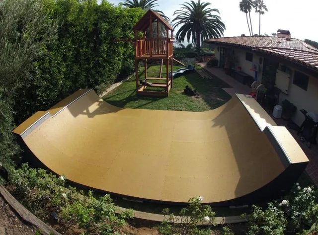 4 foot high by 16 foot wide backyard miniramp with Gator Skin surface