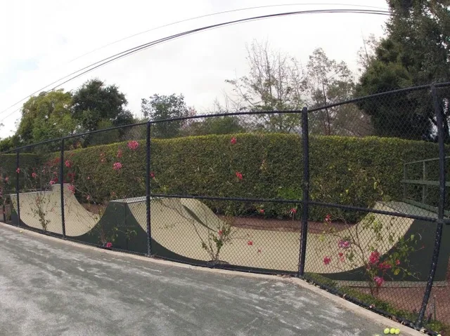 Side view of custom miniramp with pump bump, spine, and extension