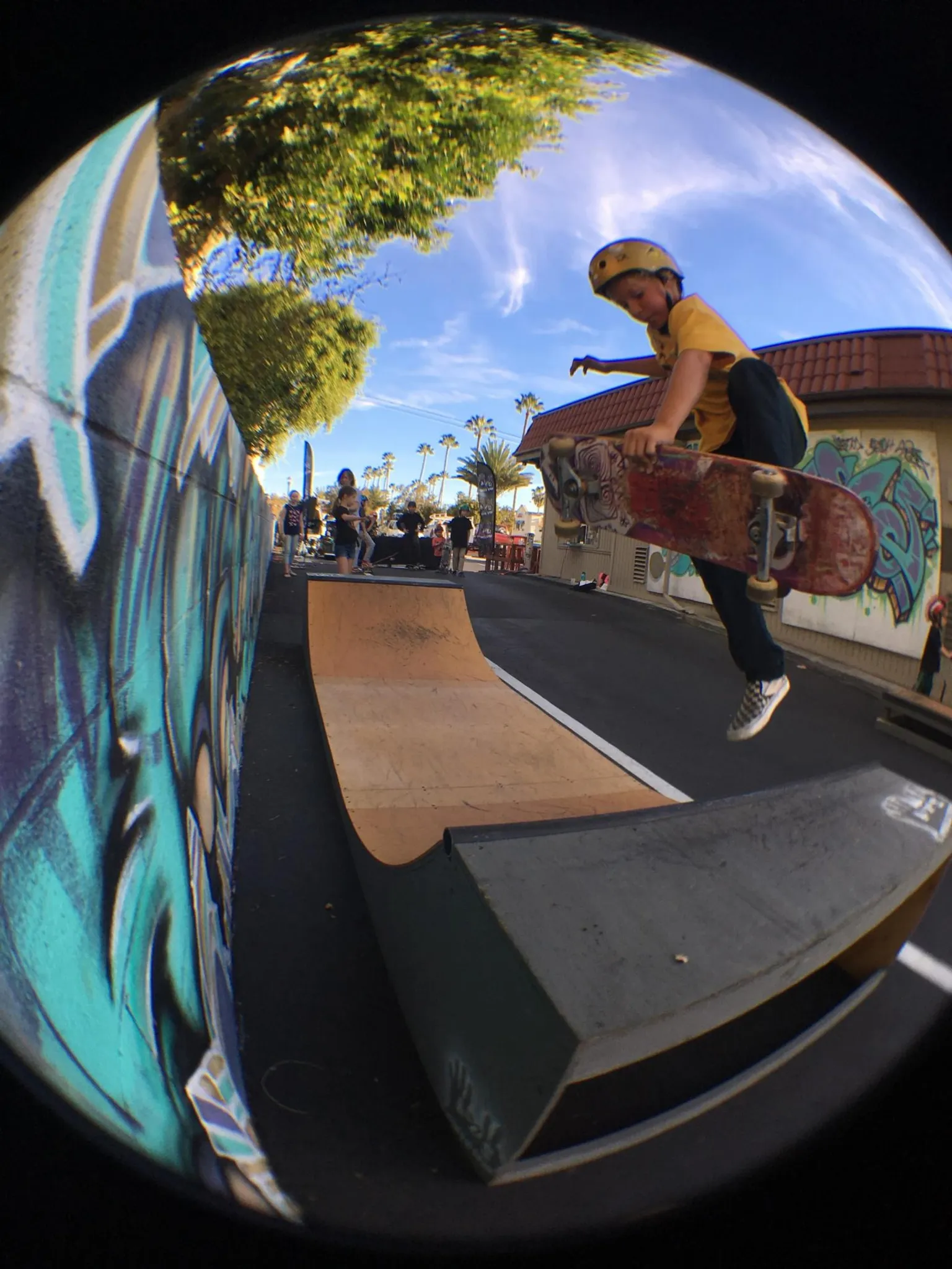 Original 2x4 miniramp with young kid blasting a frontside boneless